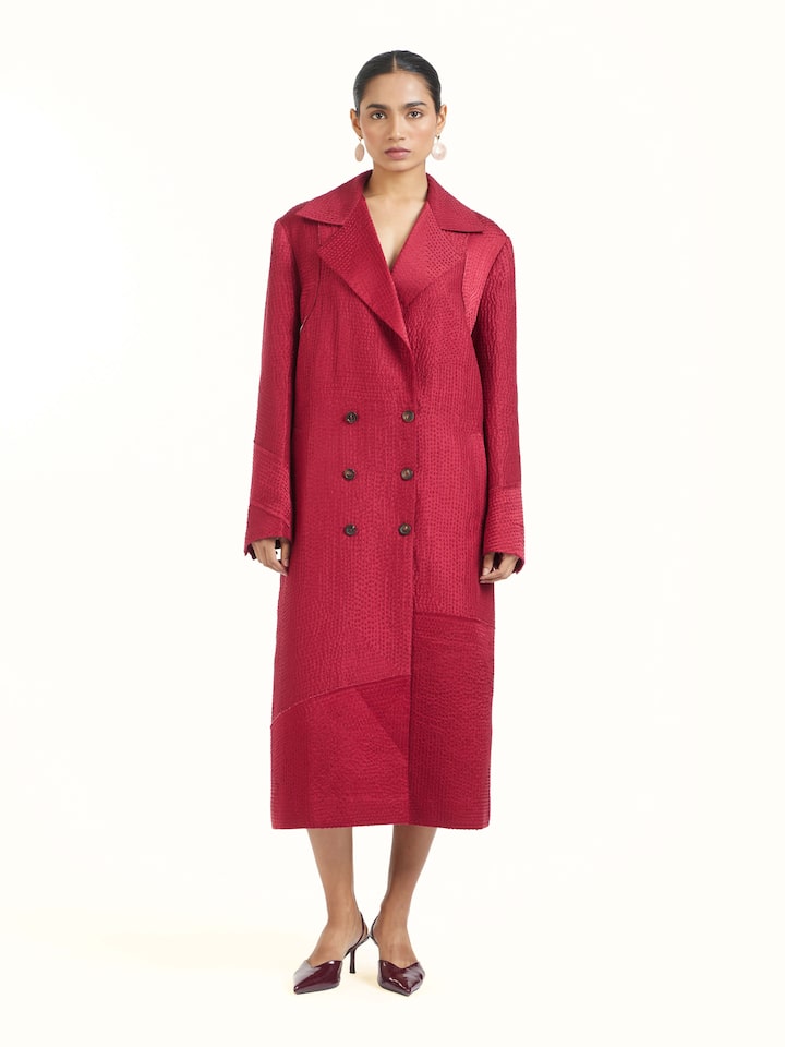 Front view of red silk kantha trench coat showcasing intricate kantha embroidery