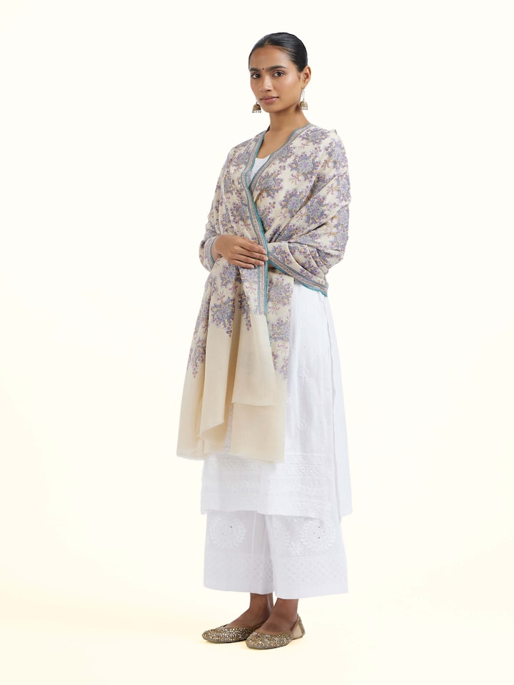 Side view of Off-white Sozni Hand Embroidered Shawl highlighting the detailed craftsmanship and elegant silhouette