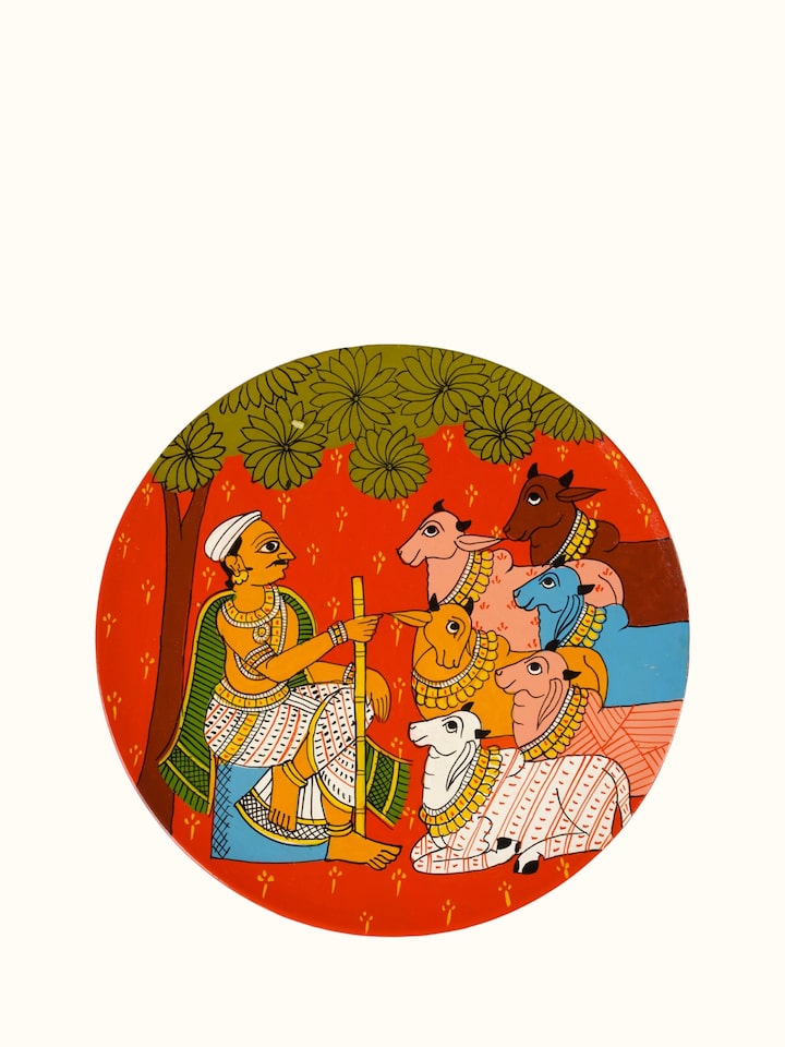 Angled view of Cheriyal Cow Handpainted Display Plate
