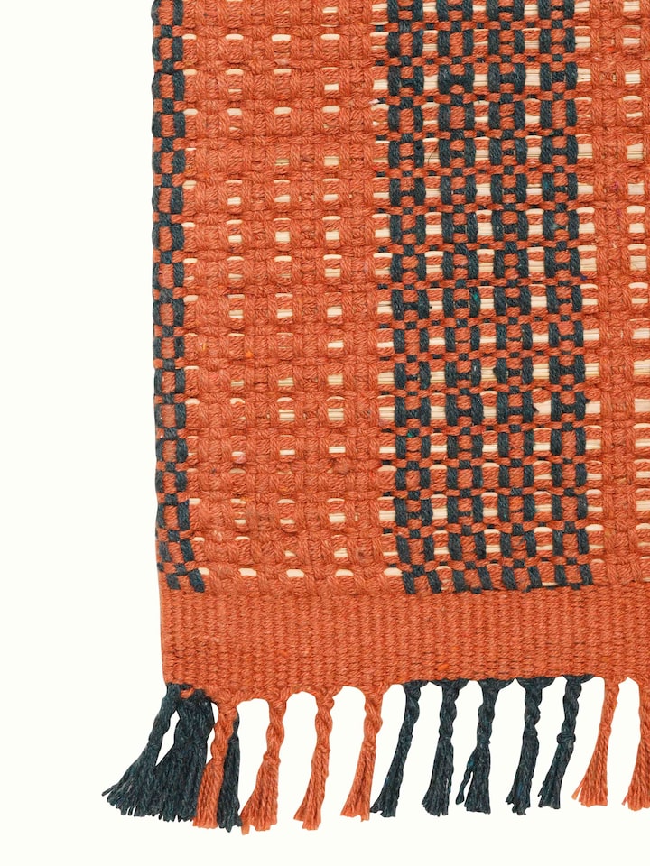 Close-up view of Swadesh Brown Natural Grass Cotton Yoga Mat focusing on its eco-conscious design and softness for yoga sessions.