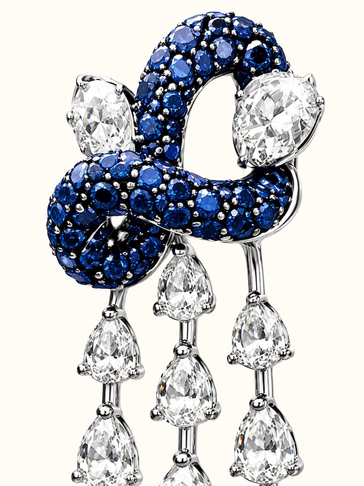 Detail view of Open Setting 14 Karat White Gold Set with Diamonds, Sapphires And Rubies highlighting the stone setting and metalwork detail, from a...