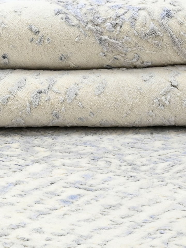 Detail view of Transitional Persian Grey Bhadohi Wool & Bamboo Silk Hand Knotted Rug highlighting the intricate pattern and pile texture, with a sl...