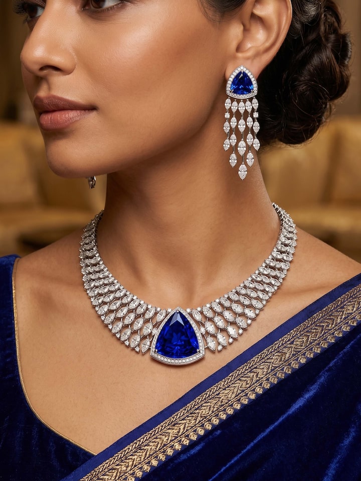 Styled view of Open Setting 14 Karat White Gold Set with Diamonds and Sapphires held in hand, showing how it looks styled, from a different angle