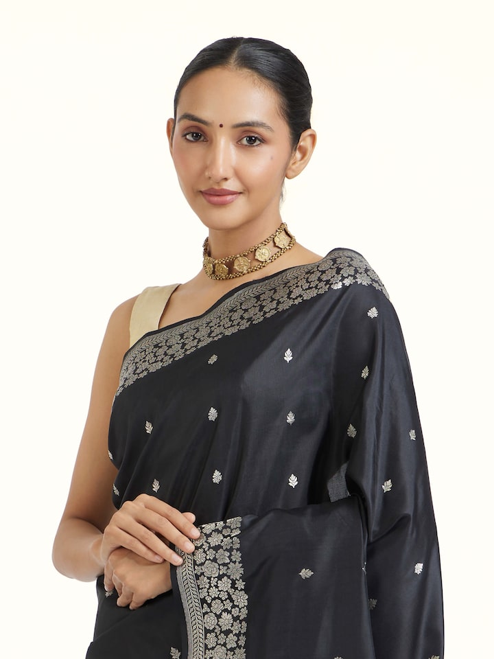 Angled view of Black Banarasi Kadhwa Silk Saree revealing the depth of its color and intricate pattern