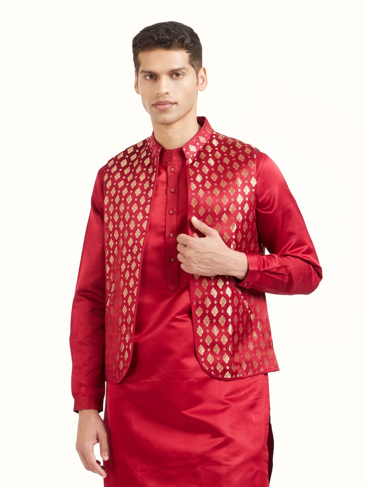Angled view of maroon silk Banarasi sleeveless jacket highlighting woven patterns