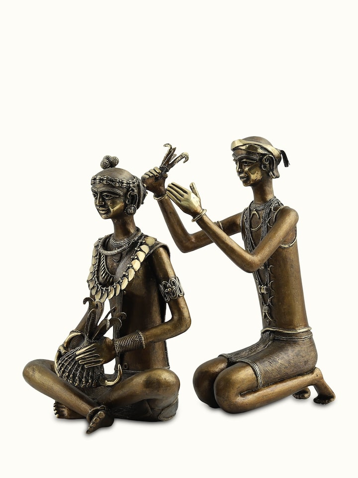 Angled view of the Dhokra Bastar Couple Brass Sculpture
