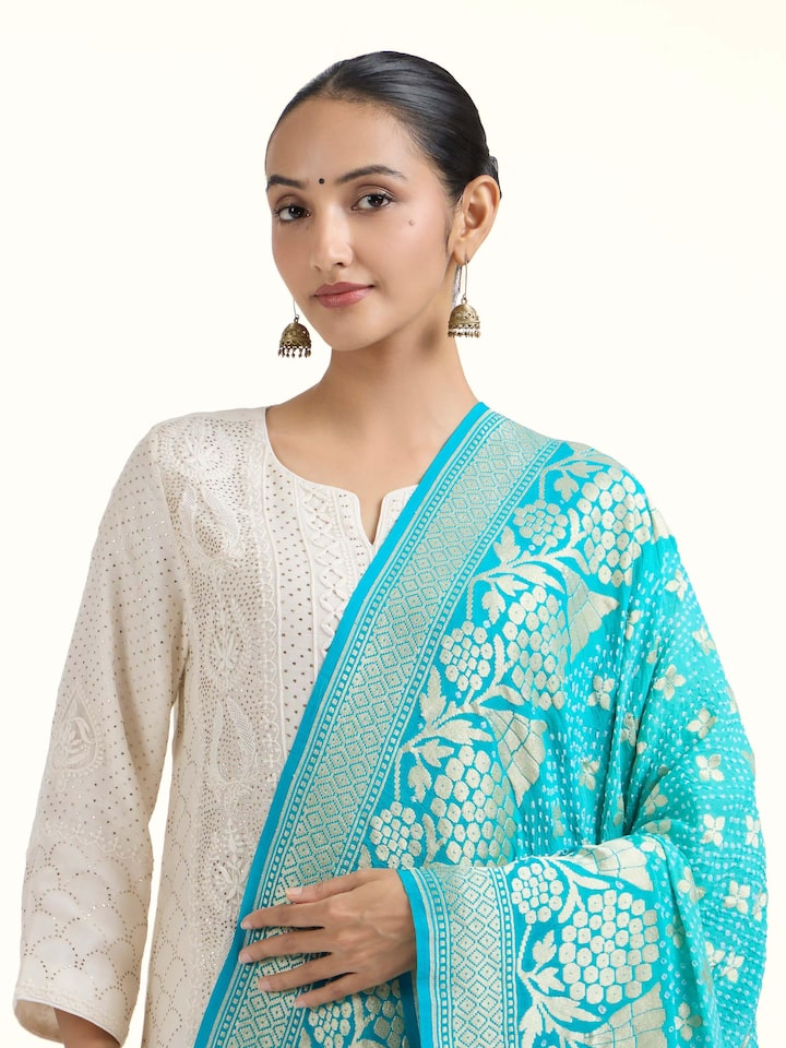 Angled view of Turquoise Bandhani Tie & Dye Dupatta revealing the depth of its color and intricate pattern