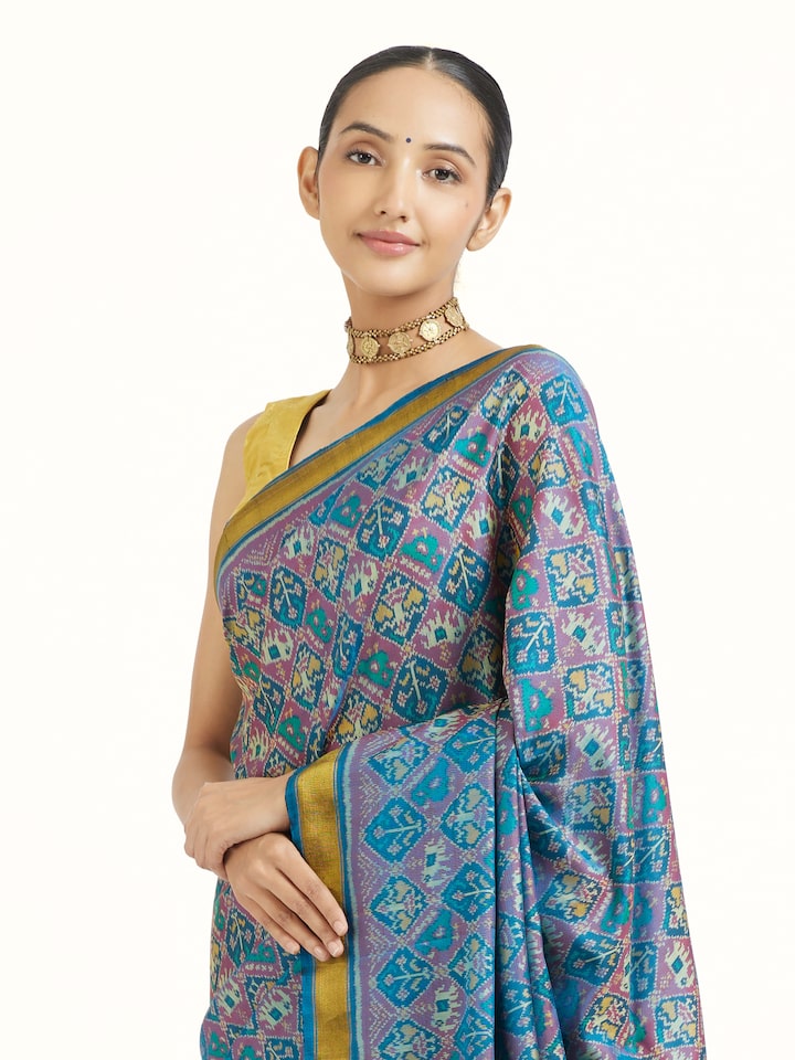 Angled view of Rajkot Micro Patola Saree revealing the depth of its color and intricate pattern