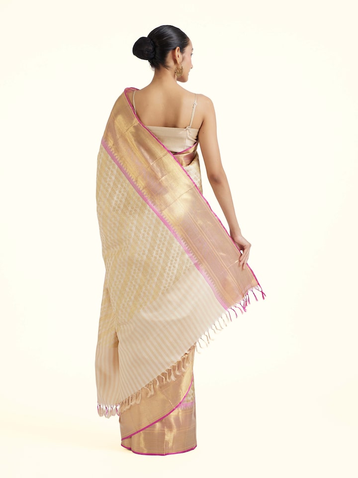 Back view of off-white silk Kancheepuram saree with ornate pallu design