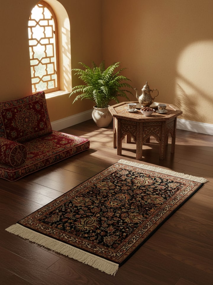 Traditional Persian navy blue Shah Abbasi Kashmir silk hand-knotted rug in living room setting – Swadesh