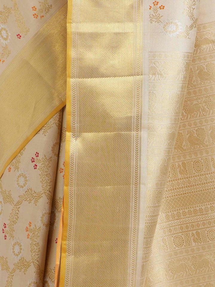 Detailed view of Beige Kancheepuram Silk Zari Saree focusing on the fine craftsmanship and texture