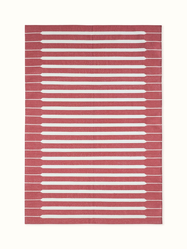 Front view showing the modern geometric red and ivory stripe pattern on Lawan cotton