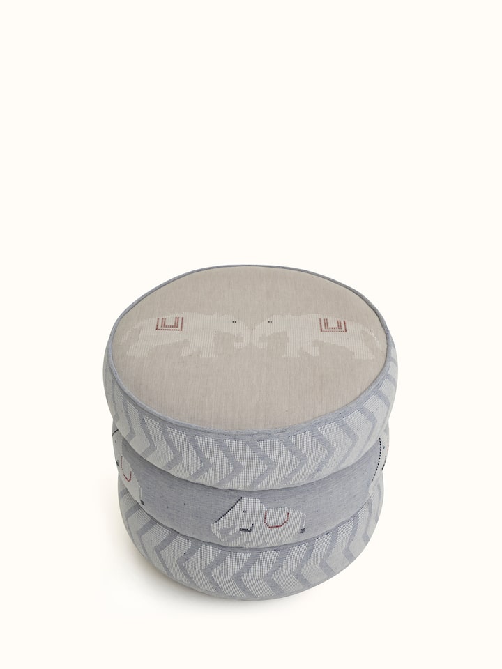 Close-up view of the pouffe’s upholstery, showcasing the intricate Bawan Buti design and texture