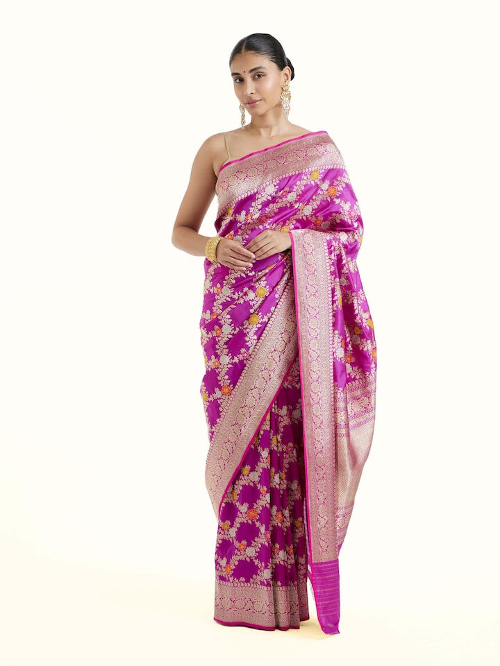 Front view of magenta Banarasi silk kadwa jaal saree with rich all-over zari motifs