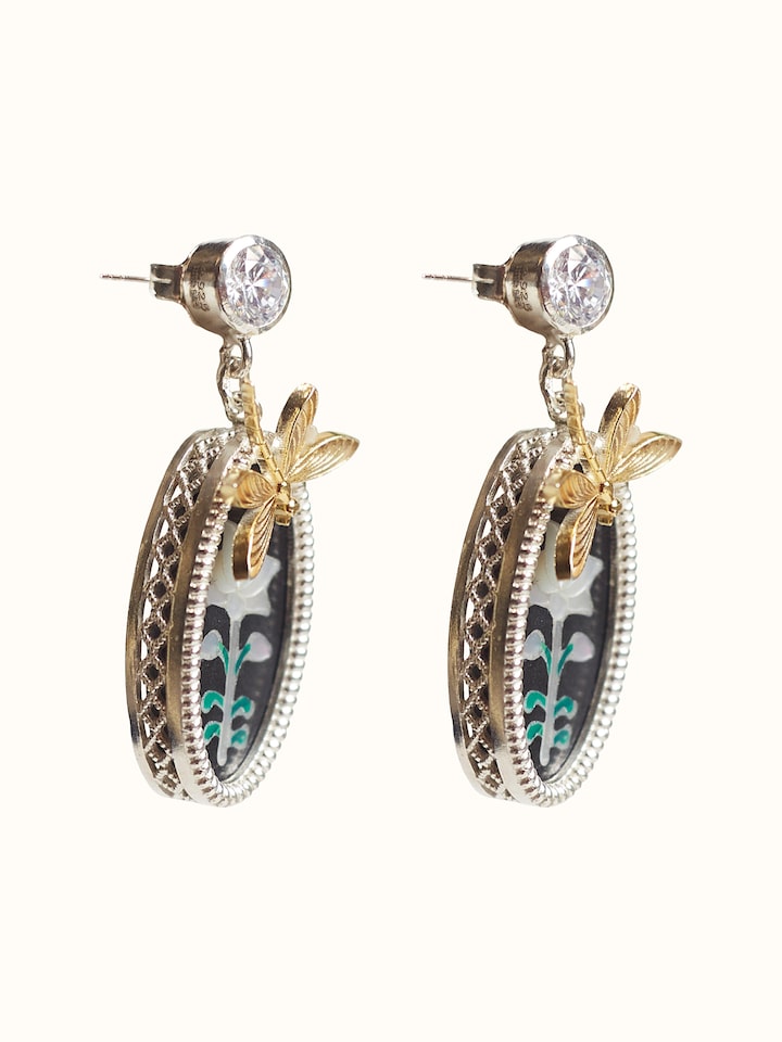 Angled view of the Parchinkari Silver Drop Earrings