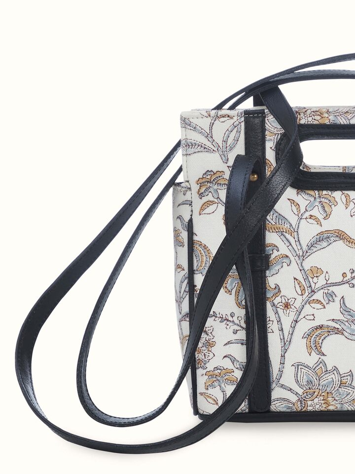 Top view showing interior compartments and secure zipper closure.