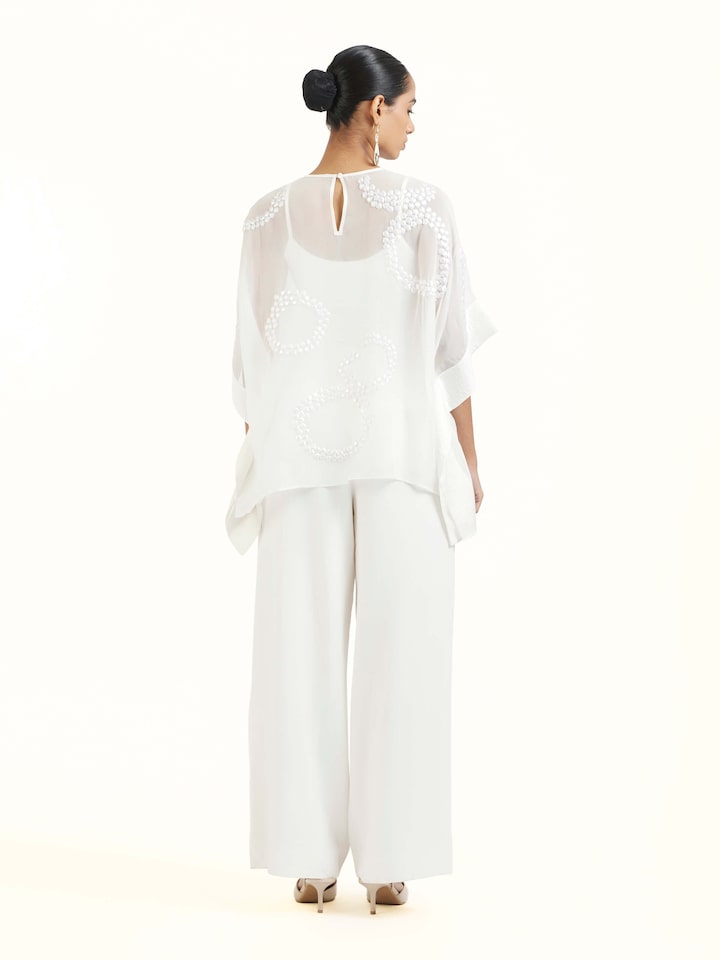 Back view of ivory hand embroidered organza kaftan displaying elegant design continuity
