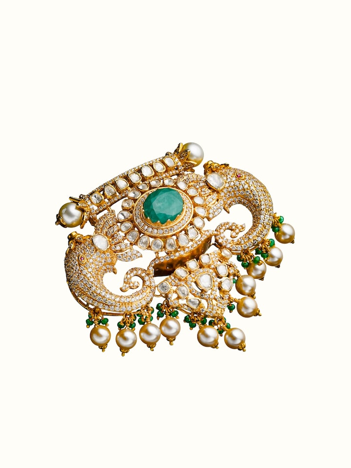 angled view of silver smithing yellow gold brooch pin