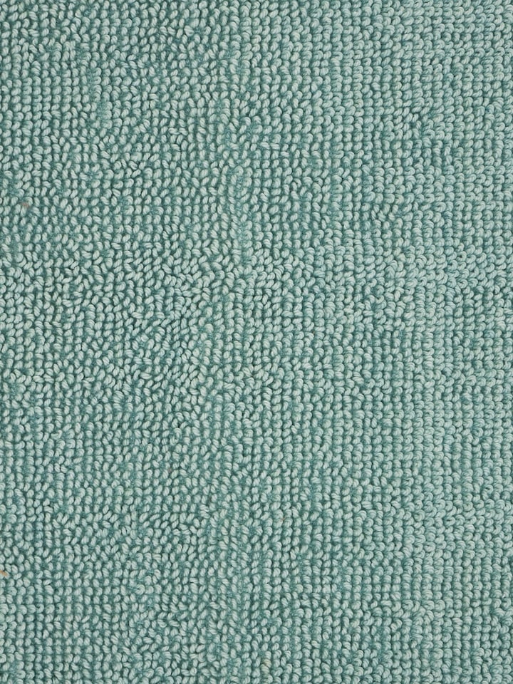 Close-up of cotton texture on Nityam light green bath mat