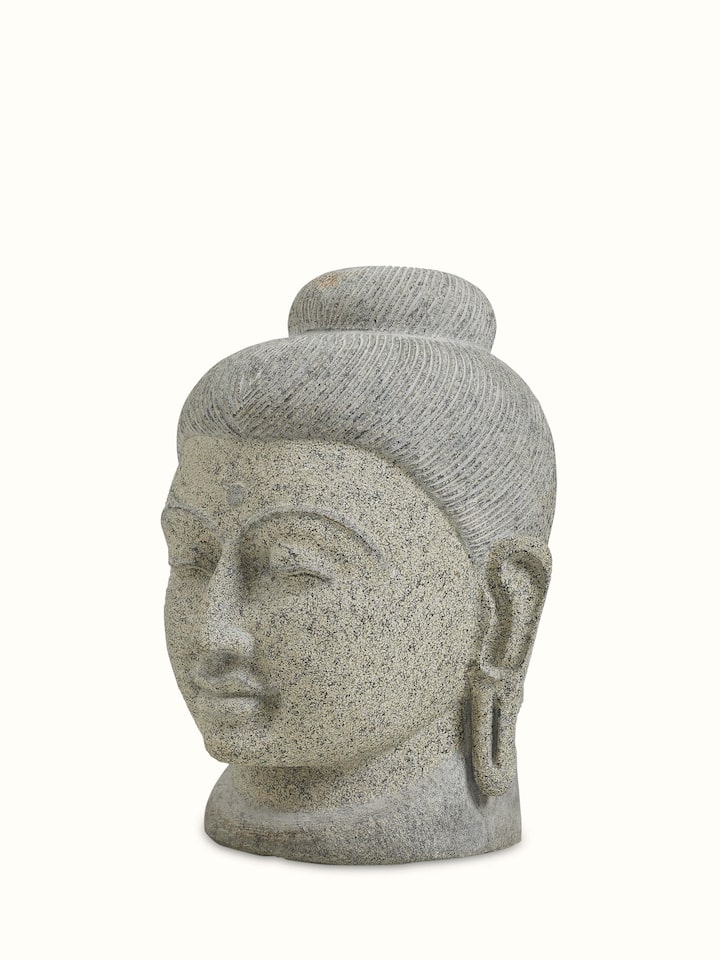 Angled view of the Stone Carved Buddha Head Sculpture