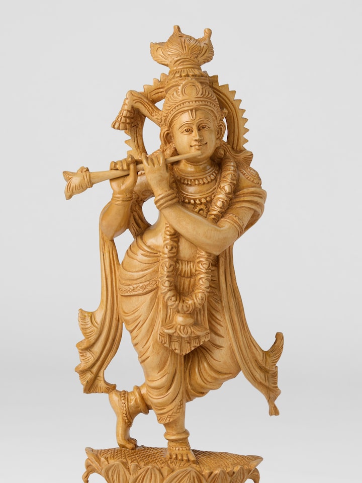 Close-up detail of the Wood Carved Krishna Flute Idol