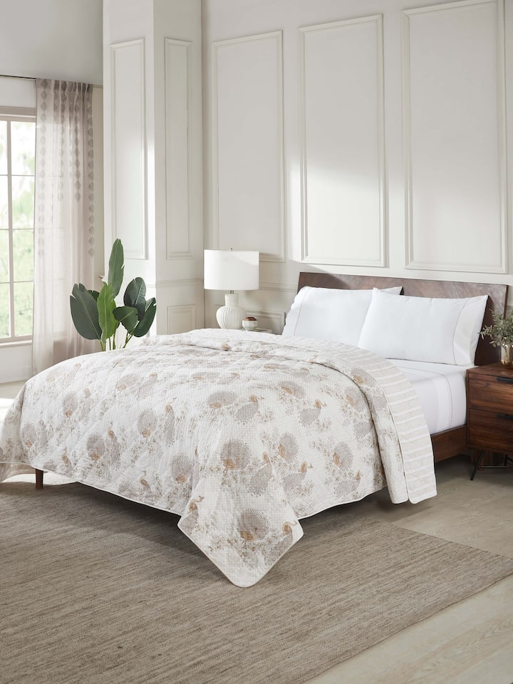 Close-up of Shivranjini beige floral cotton Sanganeri block printed double quilt
