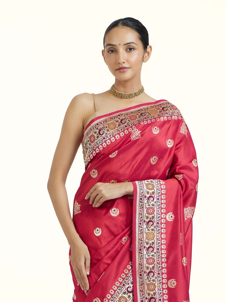 Angled view of Red Ashavali Brocade Silk Saree revealing the depth of its color and intricate pattern