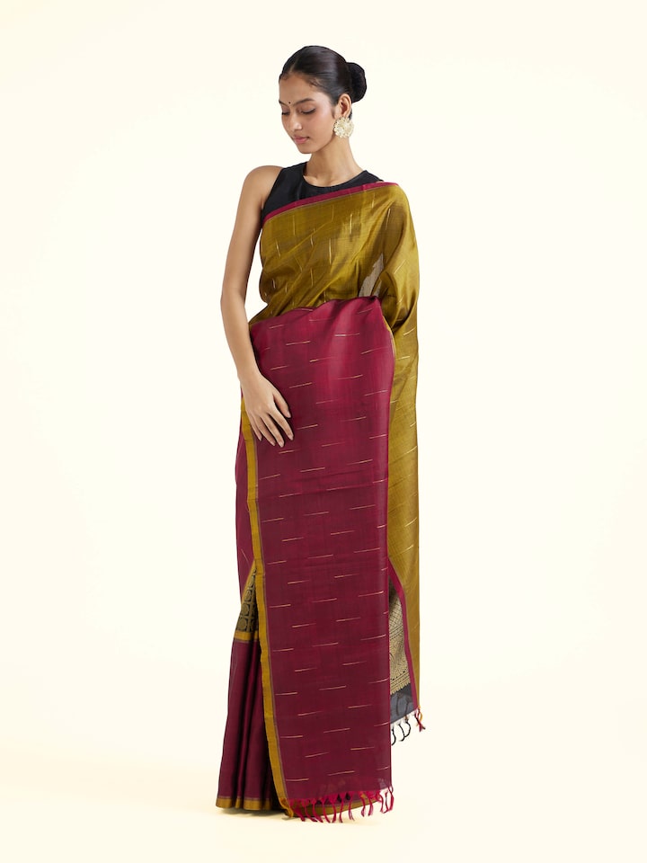 Side view of brown silk Kancheepuram saree with graceful drape and contrast border