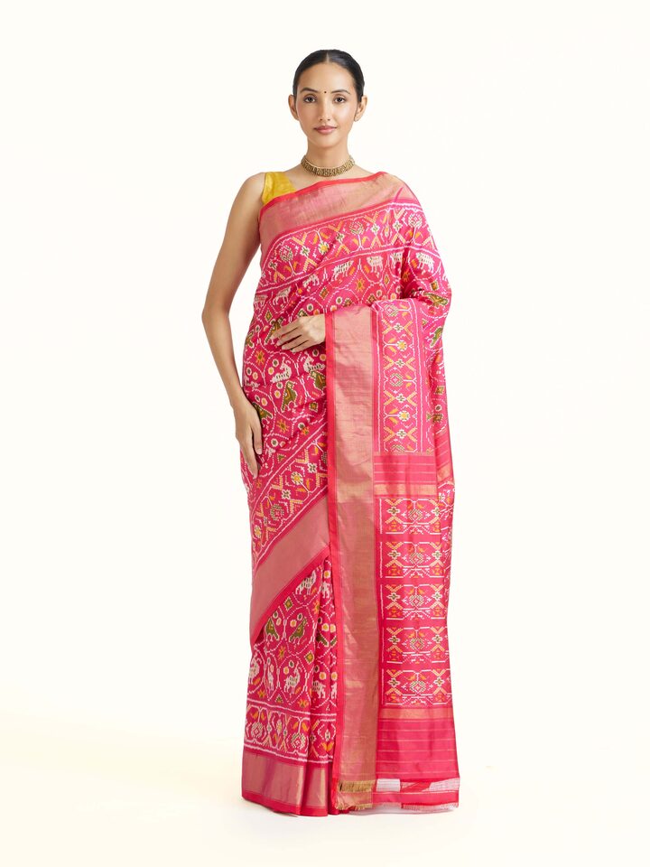 Front view of Light Pink Weft Ikat Silk Saree showcasing its traditional craftsmanship and design