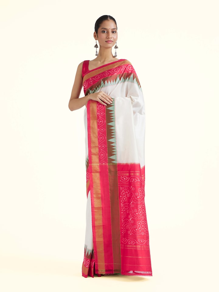 Side view of off-white mulberry silk ikat saree with elegant drape