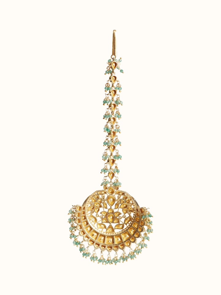 Back side view of silver smithing maang tika