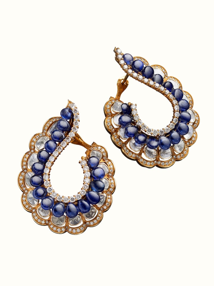 angled view of dank polki 14 karat gold hoop earrings