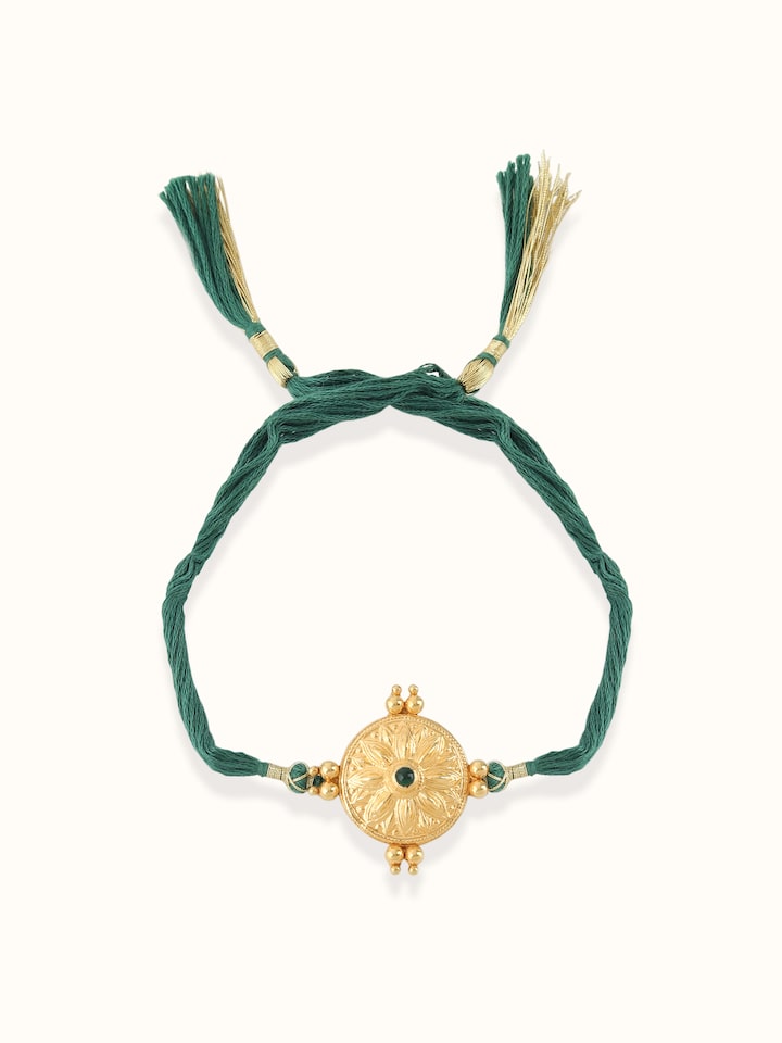 Close-up view of Silversmithing Rakhi highlighting the stone setting and metalwork detail
