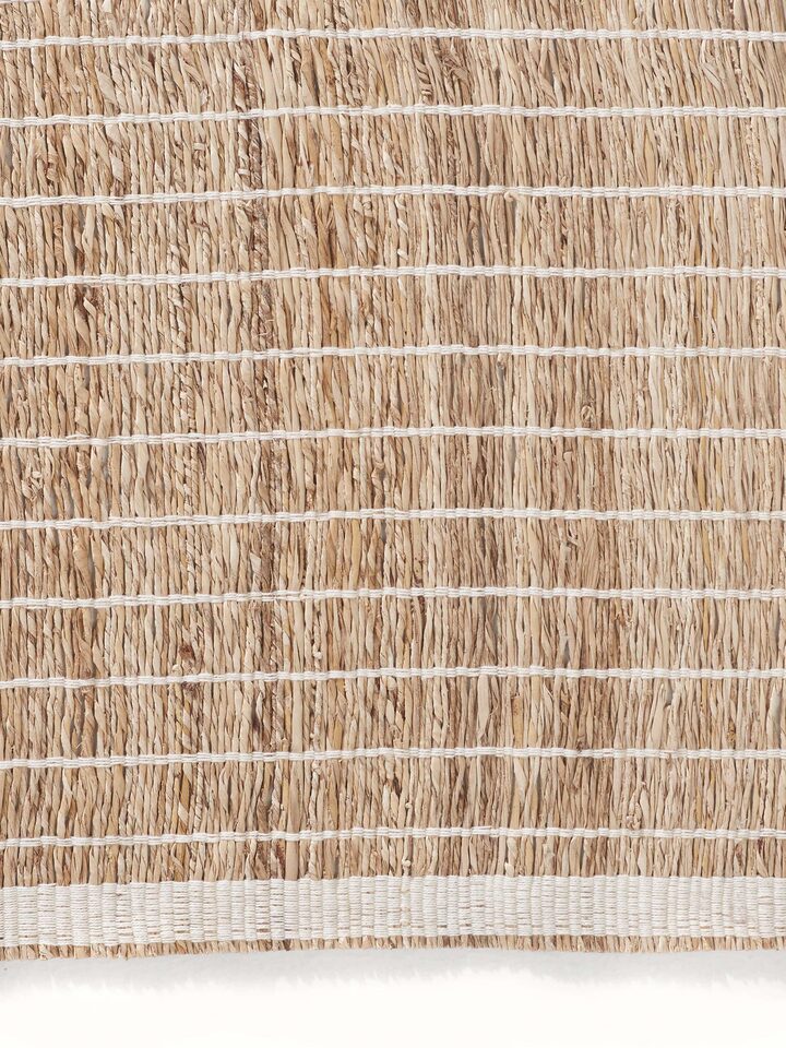 Angled side view emphasizing the natural texture and handcrafted quality of the banana fiber material