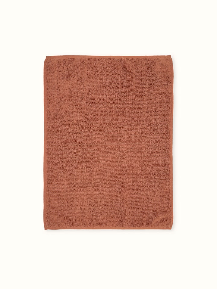 Nityam solid rust cotton bath mat – Swadesh