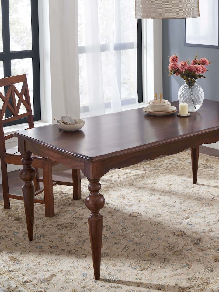 Side view of Teak Finish Sheesham Wood 6-seater Dining Table showcasing elegant design and sturdy craftsmanship.