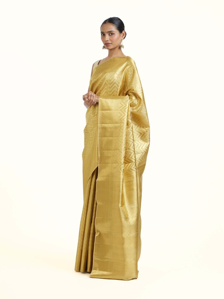 Side view of Gold Kancheepuram Silk Zari Saree highlighting the detailed craftsmanship and elegant silhouette