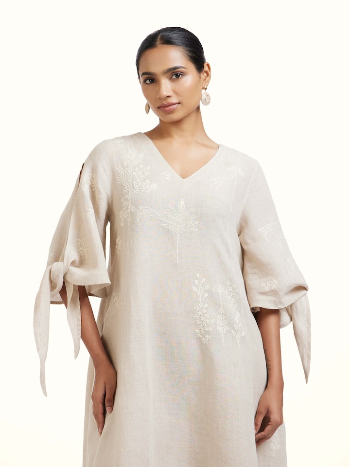 Close-up view of Natural Linen Chikankari Dress highlighting the fabric texture and embroidery detail