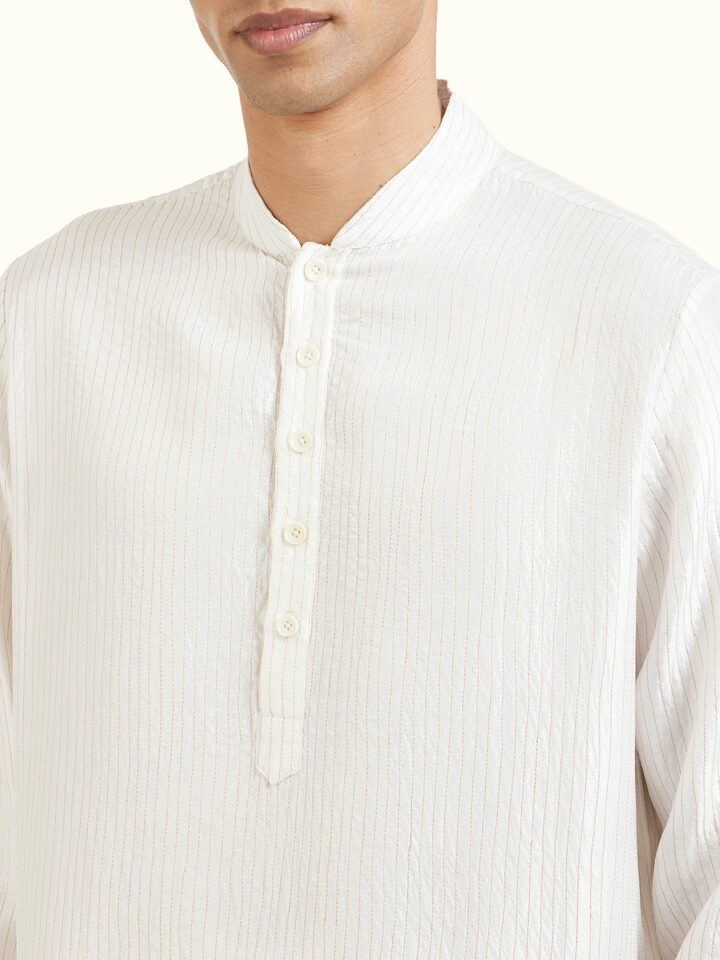 Detail view of white silk quilting short kurta showing fabric texture and craftsmanship
