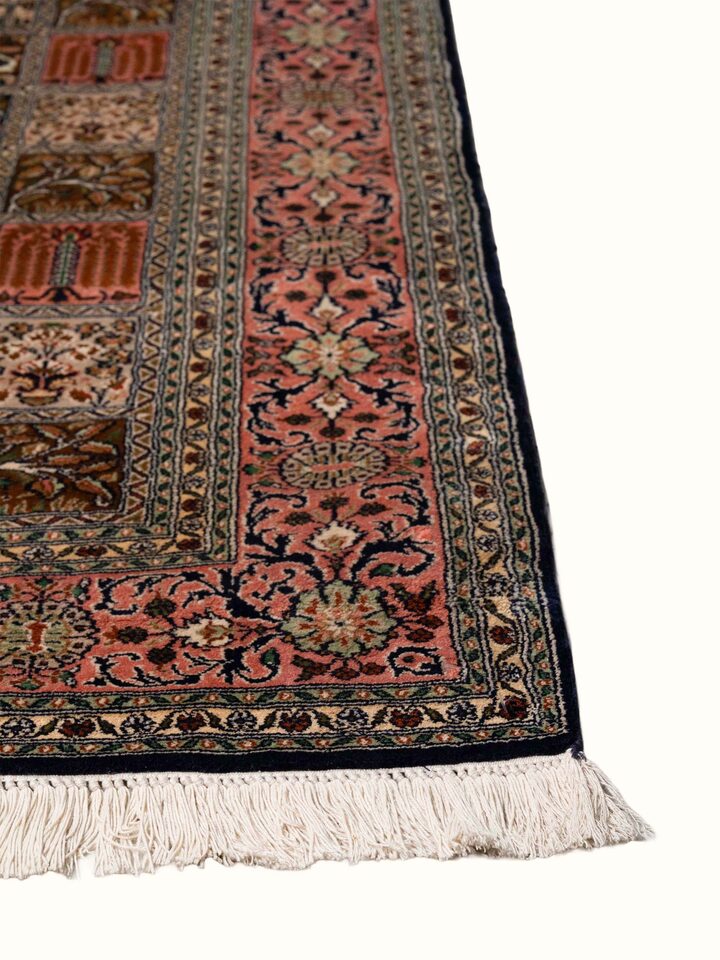 Close-up view of Traditional Persian Pink Dabdar Kashmir Silk Hand-Knotted Carpet highlighting the hand-knotted weave and motif detail