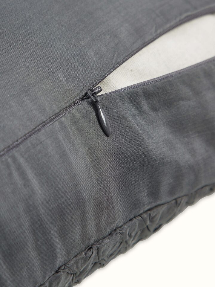 Angled shot emphasizing the intricate tie & dye design and fine silk weave