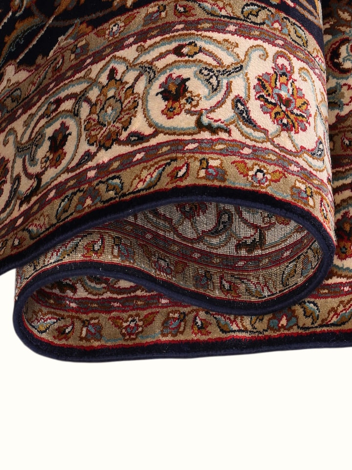 Detailed view of the Traditional Persian Navy Kashan Kashmir Silk Hand-Knotted Carpet craftsmanship