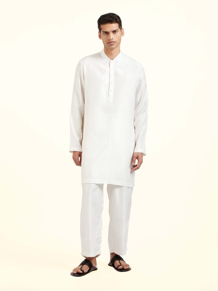 Front view of white silk quilting short kurta with textured surface detailing