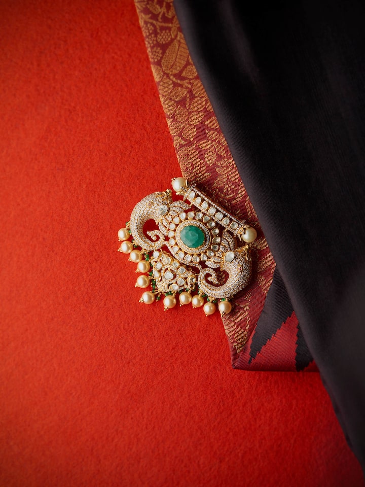 lifestyle view of silver smithing yellow gold brooch pin