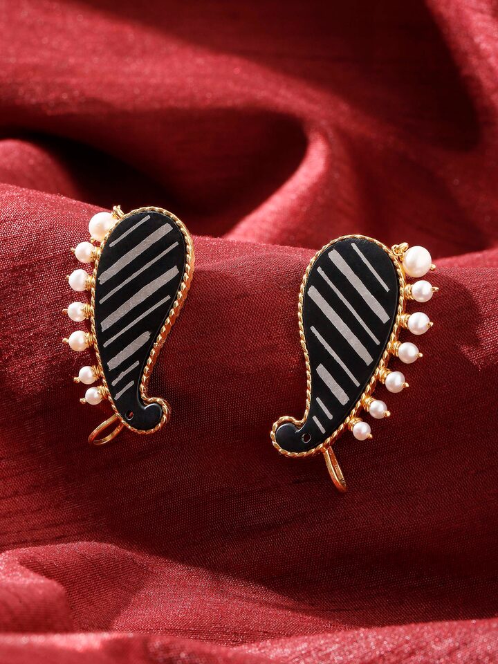 lifestyle view of bidri silver ear cuffs