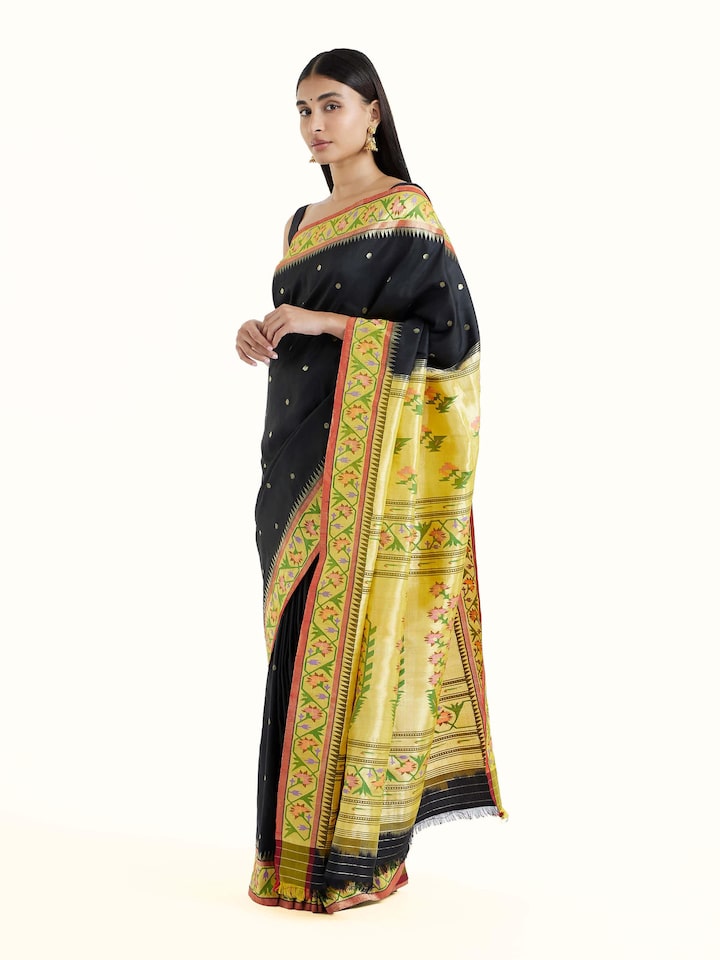 Side view of black silk Paithani saree with graceful drape and contrast border