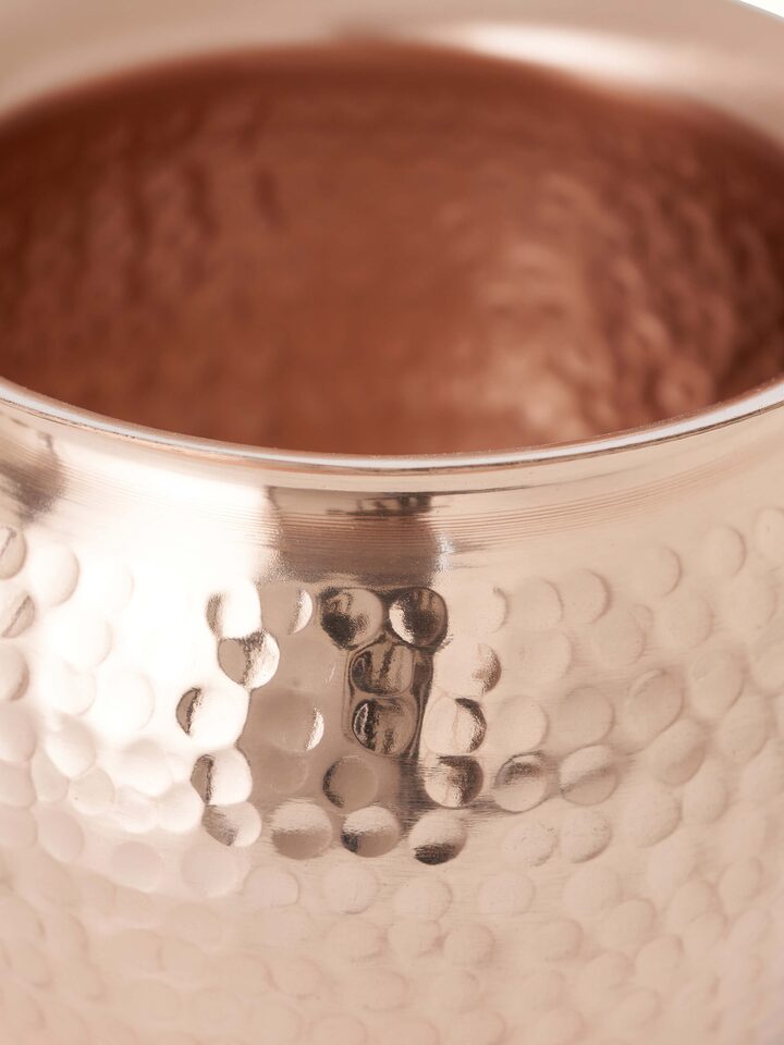 Detailed view of Polished copperware kalash