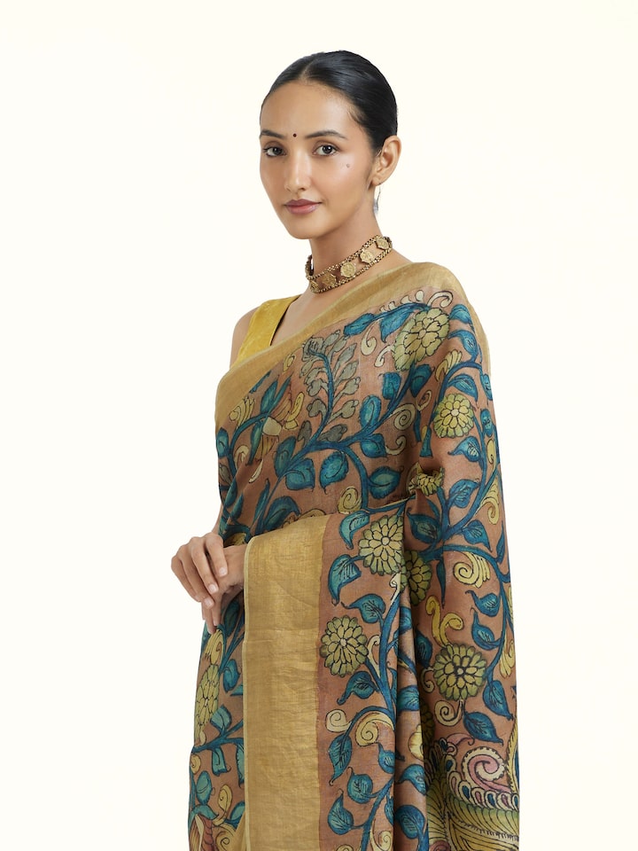 Angled view of Beige Kalamkari Tussar Silk Saree revealing the depth of its color and intricate pattern