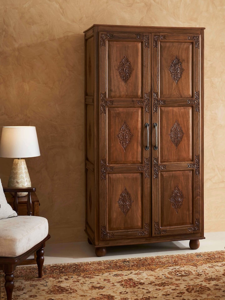 Side view of Carved Walnut Wood Wardrobe displaying intricate carvings and rich walnut wood finish.
