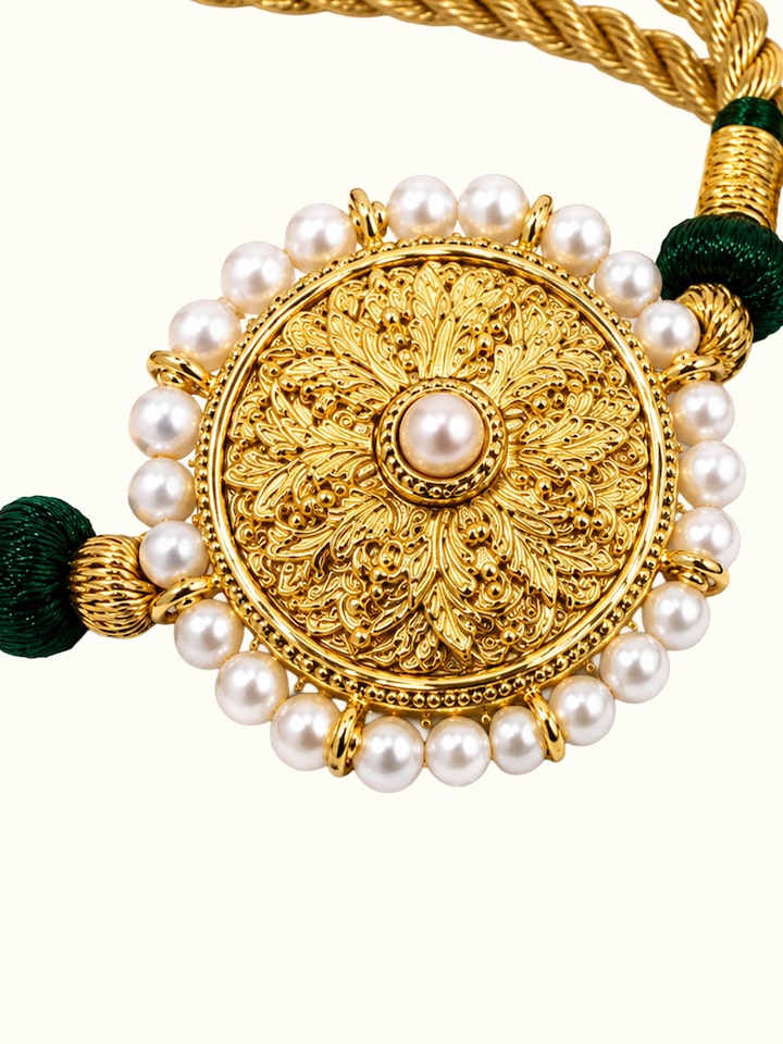 Detail view of Silversmithing Rakhi highlighting the stone setting and metalwork detail